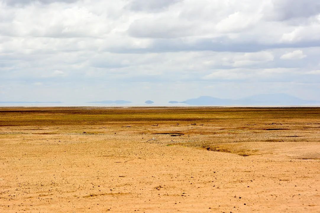 The salt flats of Lake Natron under a wide sky